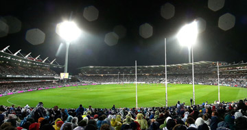 Simonds Stadium lights and players stand